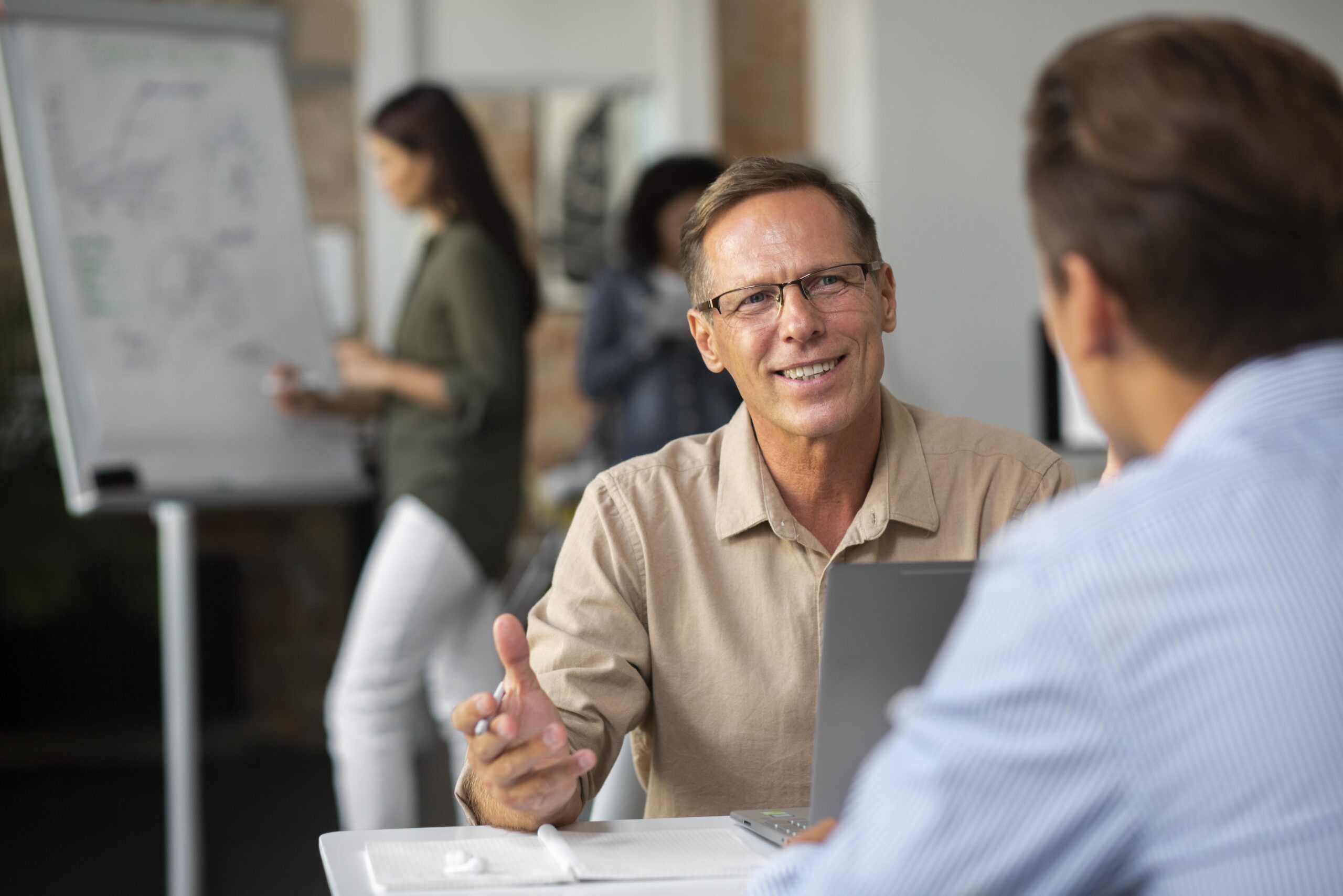 people-using-digital-device-while-meeting